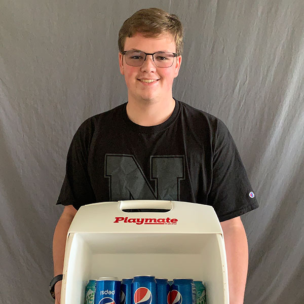 Matthew Aarstad holds the cooler full of Pepsi he won